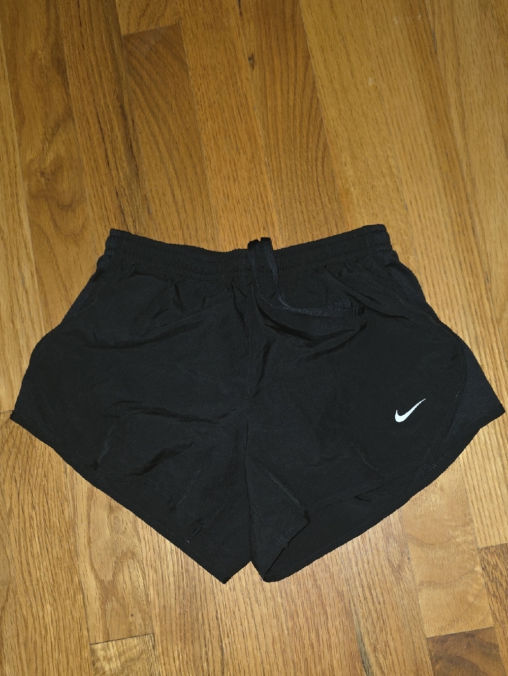 Nike Girl's Black Athletic Shorts with White Swoosh